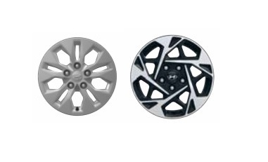 Two different Hyundai-branded alloy wheels side by side, cut out on white background.